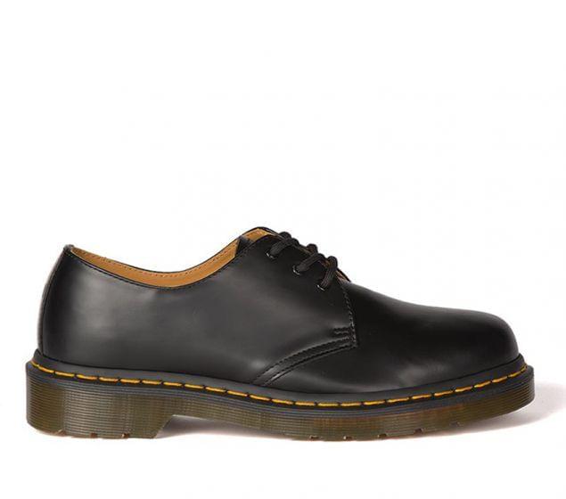 Make a statement with the iconic Dr Marten's 1461Z DMC 3-Eye shoe. Stamped with Docs trademade look, this lace-up shoe is crafted with high-quality, durable smooth lDR MARTENS | 1461 DMC 3-EYE SHOE | BLACK SMOOTH