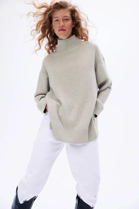 Oversized sweater in a soft knit with wool content. Rib-knit turtleneck with V-shaped opening at back of neck. Dropped shoulders, long, wide sleeves, and ribbing at Oversized Turtleneck Sweater